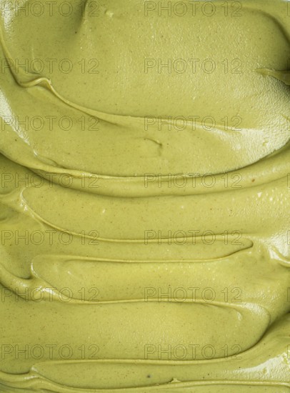 Pistachio paste texture, full frame, close-up