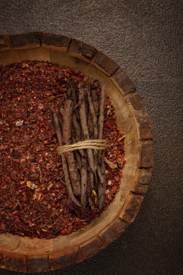 Madder dye, Endro, rhizome for coloring eggs, powder from the roots of endro with onion husks, in a wooden plate, top view, Easter, Georgia