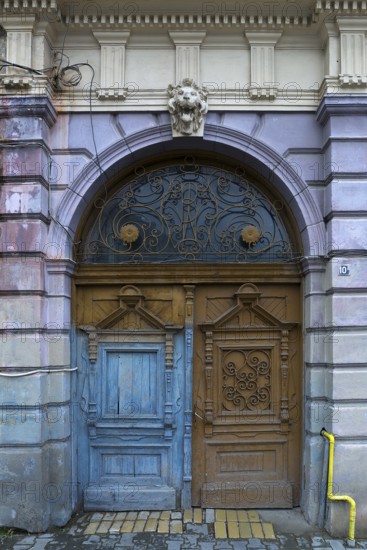 Wooden entrance portal with a 19th century residential building, Medias, Romania