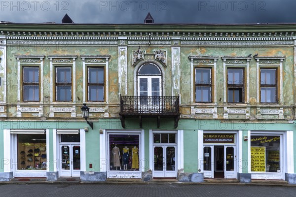 19th century house, restored shops on ground floor, upper floor not restored, Medias, Romania