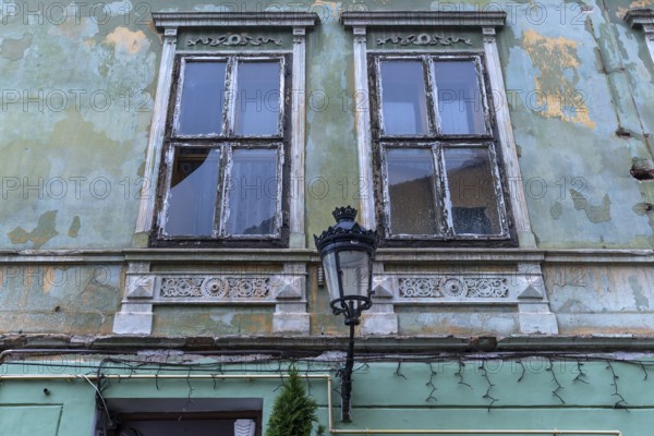 Historic lantern on a dilapidated house from the 19th century, Merias, Romania