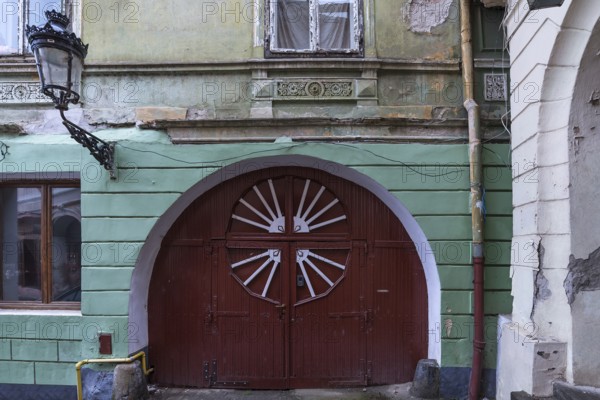 Wooden entrance gate of a 19th century house, Medias, Transylvania, Romania