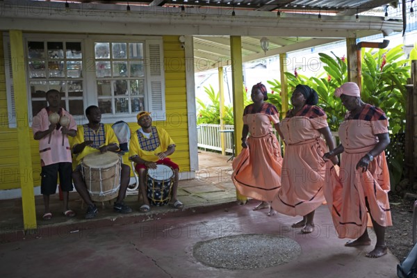 Guatemalan men playing traditional music and woman dancing, Garifuna people, Livingston, Izabal Department, Guatemala