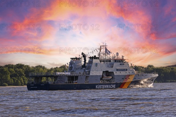 Decorated ship of the German Coast Guard and Federal Police BP 81 Potsdam leaves the Port of Hamburg on the Elbe after Hamburg's port birthday, Schleswig-Holstein, Germany