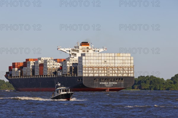 Container ship Istanbul Express sails up the Elbe towards the Port of Hamburg, shipping on the Elbe, Wedel, Schleswig-Holstein, Germany