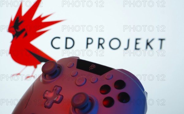 Dhaka, Bangladesh- 20 Mar 2025: A close-up of a gamepad with the CD Projekt seen on screen in the background