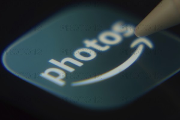 Dhaka, Bangladesh- 06 Dec 2025: Close-up of the Amazon Photos app on a screen with a stylus pointing at it