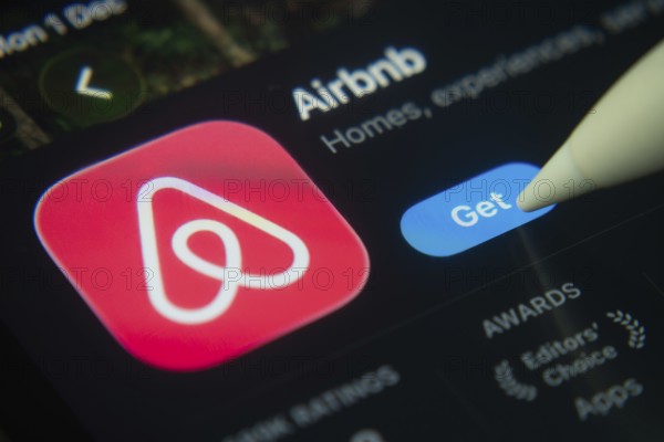 Dhaka, Bangladesh- 01 Dec 2025: A close-up of the Airbnb app icon in the App Store on an iPad screen