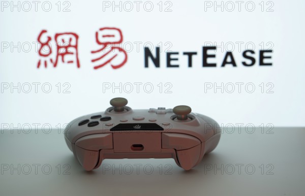 Dhaka, Bangladesh- 08 Apr 2025: A gaming controller in front of a NetEase screen