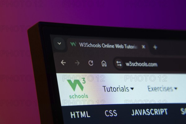 Dhaka, Bangladesh- 02 June 2025: Close-up of a computer screen displaying the W3Schools web interface in dark mode