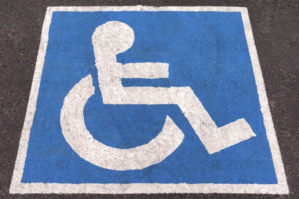 Parking space marked in blue for disabled people, Romania