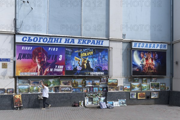 Sales exhibition of paintings in front of a cinema, Czernowicz, Bukovina, Ukraine