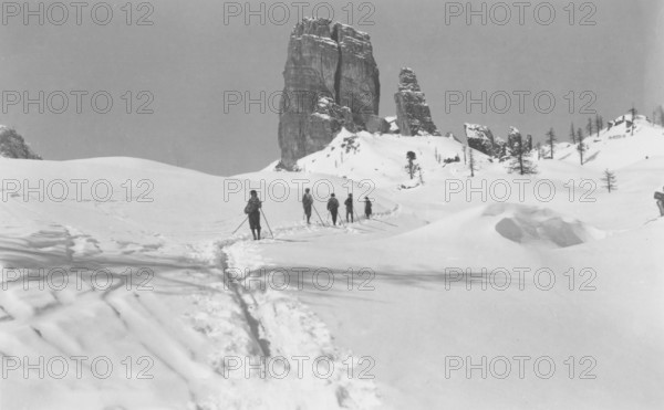 Ski hike in winter at the Cinque Torri (five towers), snow, Alps, group, mountaineer, skier, around 1930, high mountains, mountain, historical, Ampezzo Dolomites, South Tyrol, Veneto, Italy