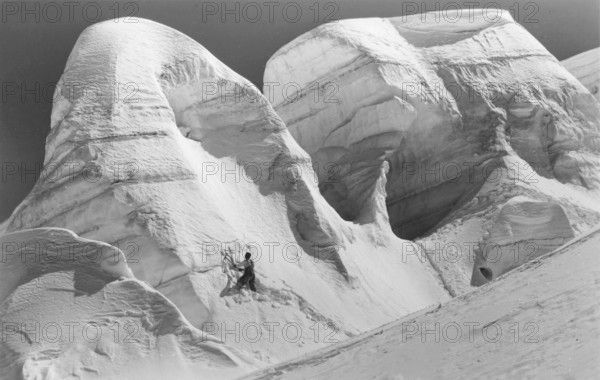 Winter, mountaineer with ice axe climbing in snow and ice, mountaineering in the Alps, mountaineers, glaciers, ice axe, around 1930, high mountains, mountain, historic, South Tyrol, Italy