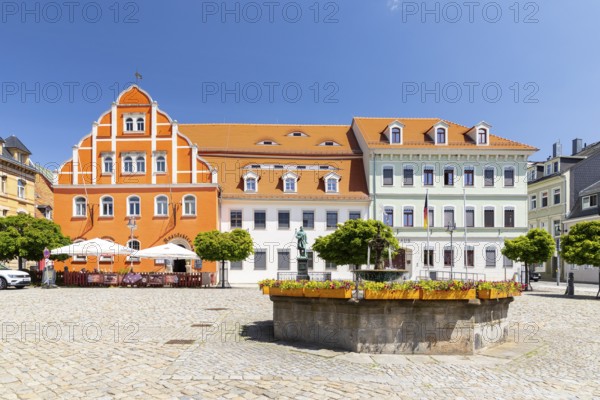 Medieval market square with town hall with Renaissance gable, monument to sculptor Ernst Rietschel and sandstone market fountain, Pulsnitz, Saxony, Germany