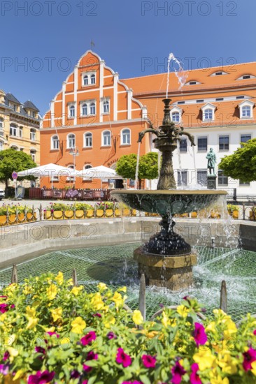 Medieval market square with town hall with Renaissance gable, monument to sculptor Ernst Rietschel and sandstone market fountain, Pulsnitz, Saxony, Germany
