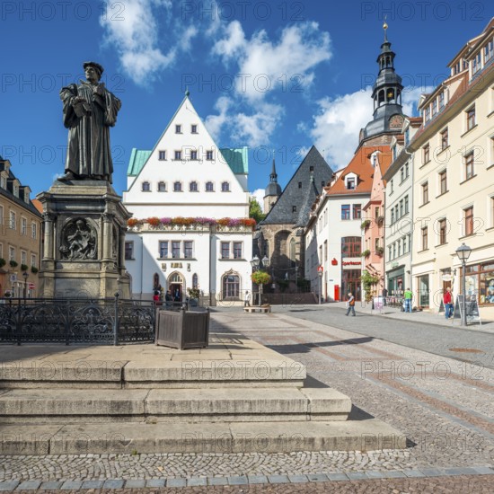 The market square of Eisleben with the monument to Martin Luther, Luther monument, bronze sculpture from 1883 by Rudolf Siemering, in the middle the historic town hall, St. Andrew's Church on the right, Luther city Eisleben, Saxony-Anhalt, Germany