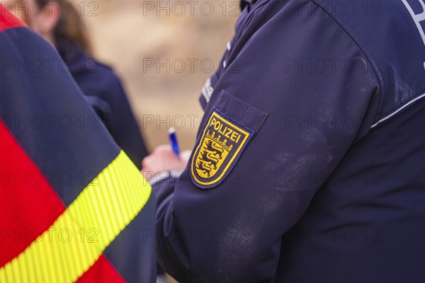 Close-up of a police uniform badge. Writing and coat of arms are visible, fire brigade exercise at the Hermann Hesse Railway, Ostelsheim, Calw district, Germany
