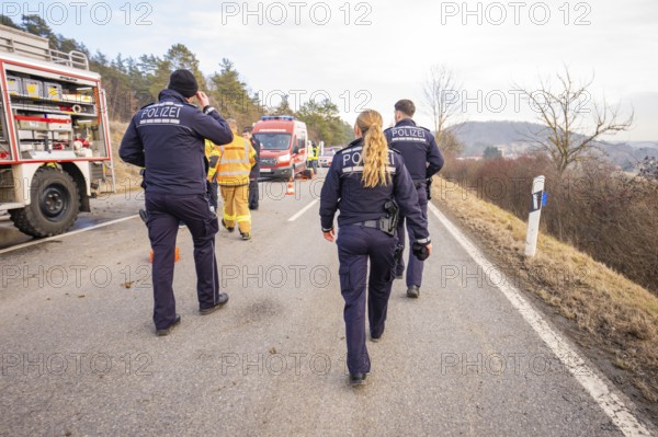 Officials are walking on a street towards an operation. Ambulances and fire engines can be seen, fire brigade exercise at the Hermann Hesse Railway, Ostelsheim, Calw district, Germany