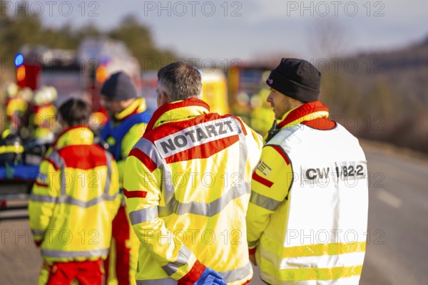 Rescue workers and firefighters discuss during an emergency operation, fire brigade exercise on the Hermann Hesse railway, Ostelsheim, Germany
