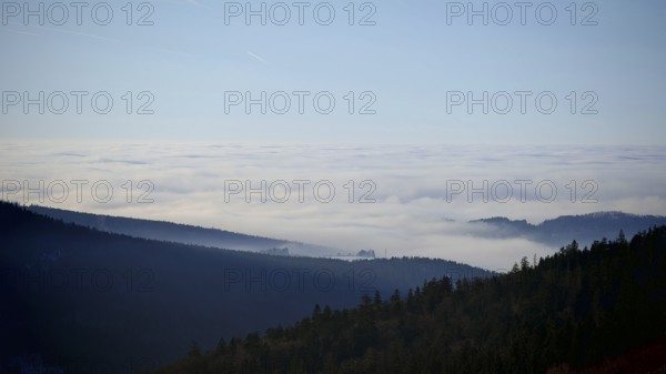 Mountains and hills covered in fog under a clear sky, Fichtelgebirge
