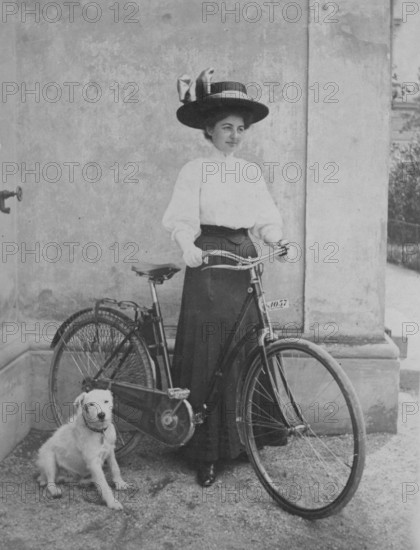 Woman with her bicycle, dog, skirt and hat, fashion, August 1909, historical, Salzburg, Austria
