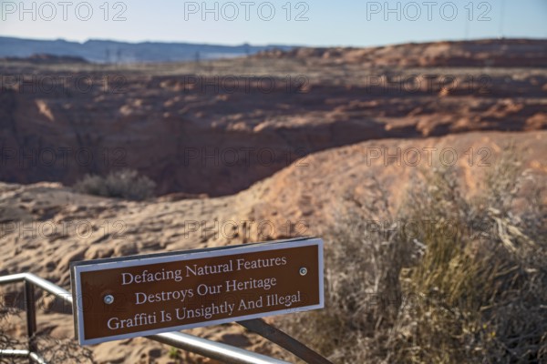 Page, Arizona - A sign at a viewpoint for the Glen Canyon Dam asks visitors to refrain from placing graffiti on the rocks