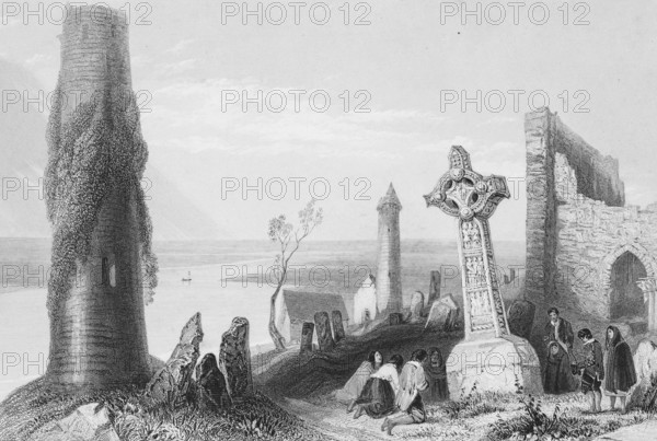Ruins of the Clonmacnoise monastery complex with cemetery, Clonmacnoise on the Shannon River, County Offaly, Ireland, Celtic cross, priest, praying people, kneeling down, path, round towers, decay, landmark, steel engraving, 19th century, historical illustration from 1845
