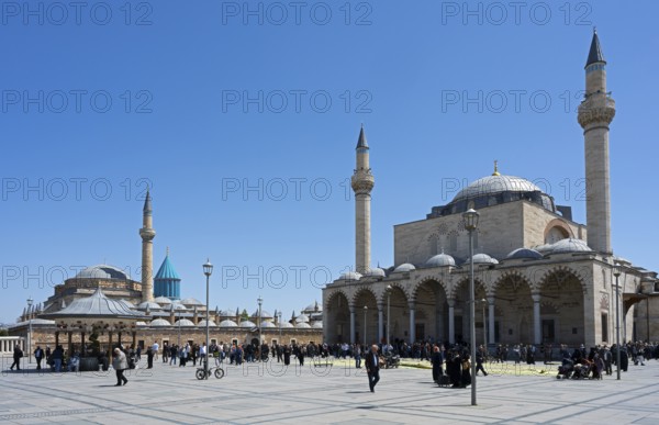 Large square in front of a mosque with people in a quiet atmosphere, Mevlana Museum, Mevlana, landmark, mausoleum of Mevlânâ Jalal ad-Din Rumi, Konya Sultan Selim Camii, Konya, Central Anatolia, Turkey