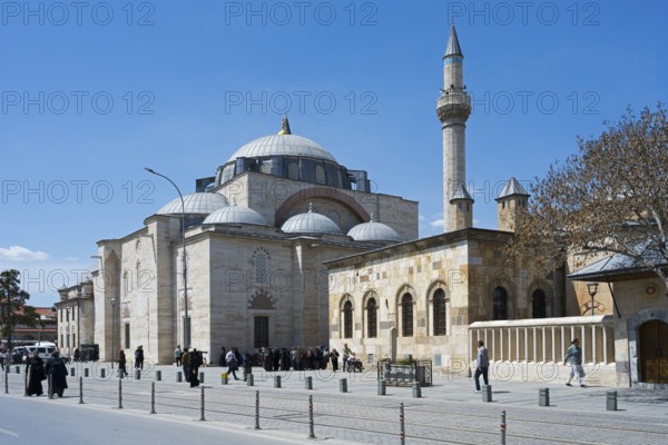 Historic mosque with minaret, many people animate the surrounding area, Mevlana Museum, Mevlana, Mausoleum of Mevlânâ Jalal ad-Din Rumi, Konya Sultan Selim Camii, Konya, Central Anatolia, Turkey