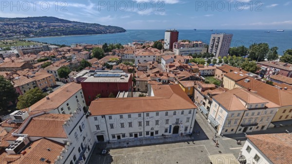 View of a coastal town with red roofs and the sea in the background, Izola, Slovenia
