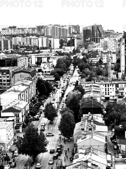 Aerial view of an urban environment with high-rise buildings and roads in black and white, Pristina, Kosovo