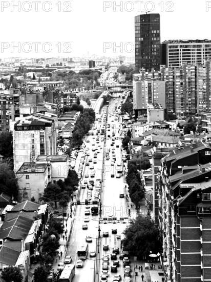 City view of a busy street with skyscrapers in the background in black and white, Pristina, Kosovo