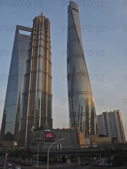Two impressive modern skyscrapers, Shanghai Tower, at sunset, Shanghai, China