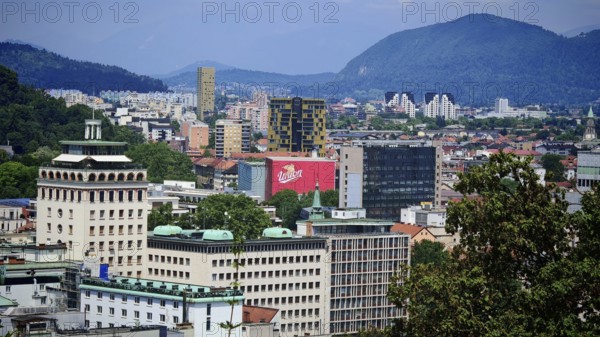 Urban landscape with modern buildings and mountain views in the background, city view of Ljubljana, Slovenia