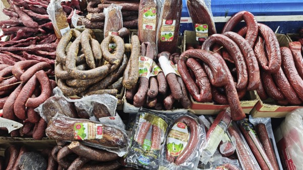 Different types of sausages offered for sale at a market, Skopje, North Macedonia