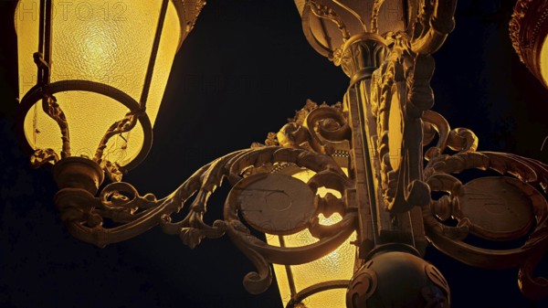 Close-up of an artfully designed lantern with golden lighting at night, Skopje, North Macedonia