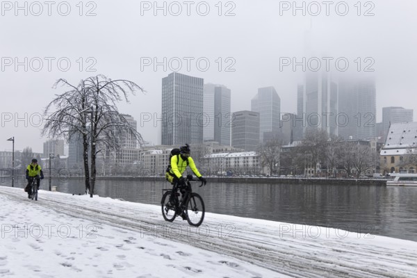 Clouds envelop Frankfurt's banking skyline. Heavy snowfalls have caused another onset of winter in the Main metropolis, Osthafen, Frankfurt am Main, Hesse, Germany