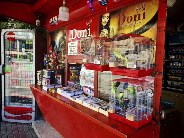 A colorful street kiosk with various products and drinks for sale, Kosovo