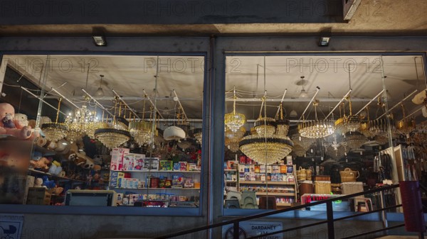 An illuminated shop with various lights and lamps in a shop window, Kosovo