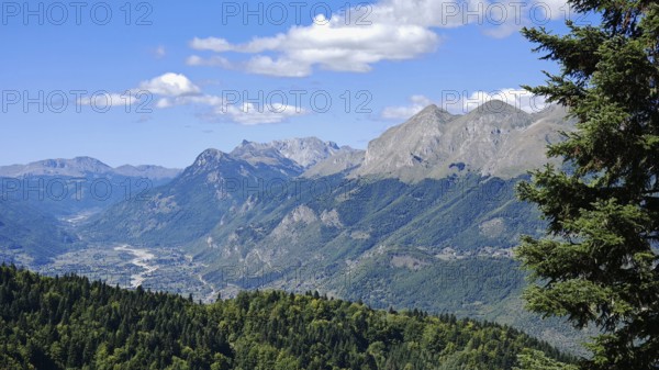 Extensive mountain range in sunny weather with lush forest and clear sky, Peaks of the Balkans, Montenegro