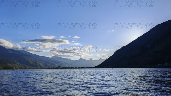 View of a lake with mountains in the background and a clear blue sky, Plav Lake, Montenegro