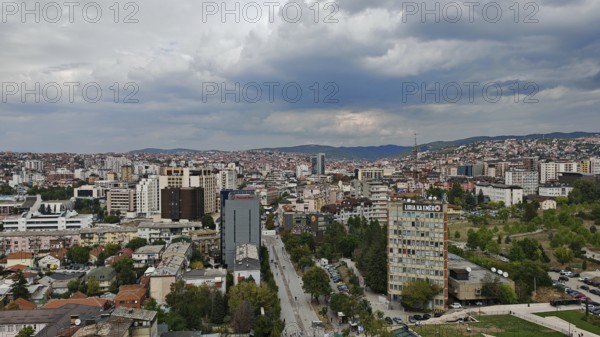 Panoramic view of a city with thick clouds in the sky, Pristina, Kosovo