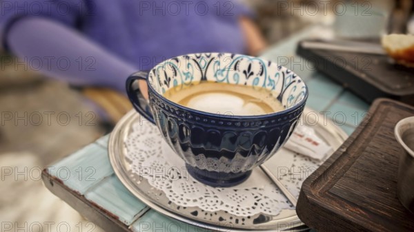 Detail of a decorated coffee cup on saucer in a cafe, Prizren, Kosovo
