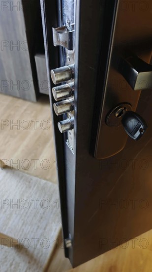 Close-up of an opened door lock with visible metal bolts, security in hotel, Kosovo