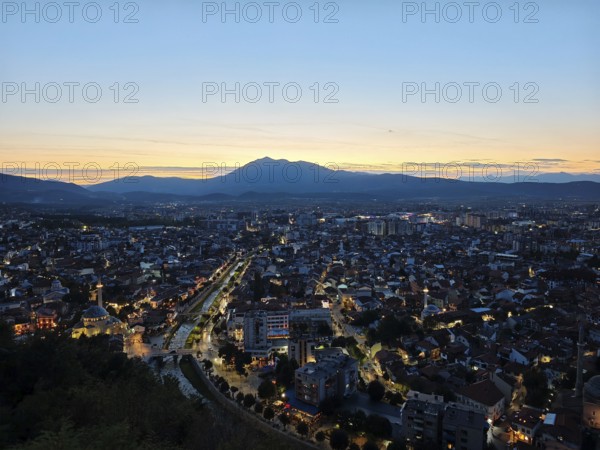City view at sunset with bright sky and illuminated roads, Prizren, Kosovo