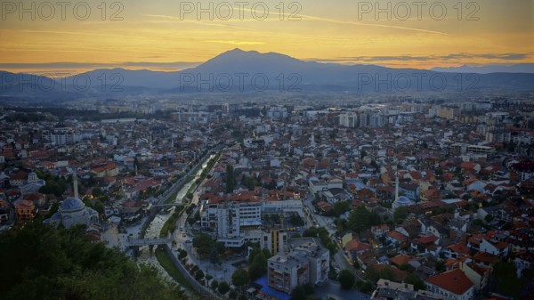 City view at sunset, illuminated roads and mountains in the background, Prizren, Kosovo