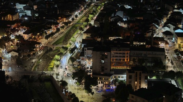 Aerial view of an illuminated city at night along a river, Prizren, Kosovo