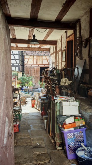 View of a rustic courtyard full of old tools and objects, Upper Franconia