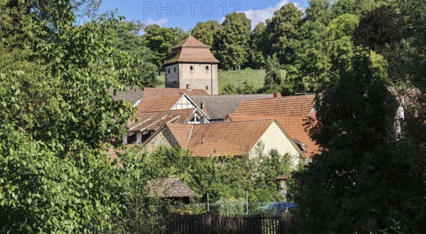 Charming village with historic tower, nestled in green countryside, Upper Franconia